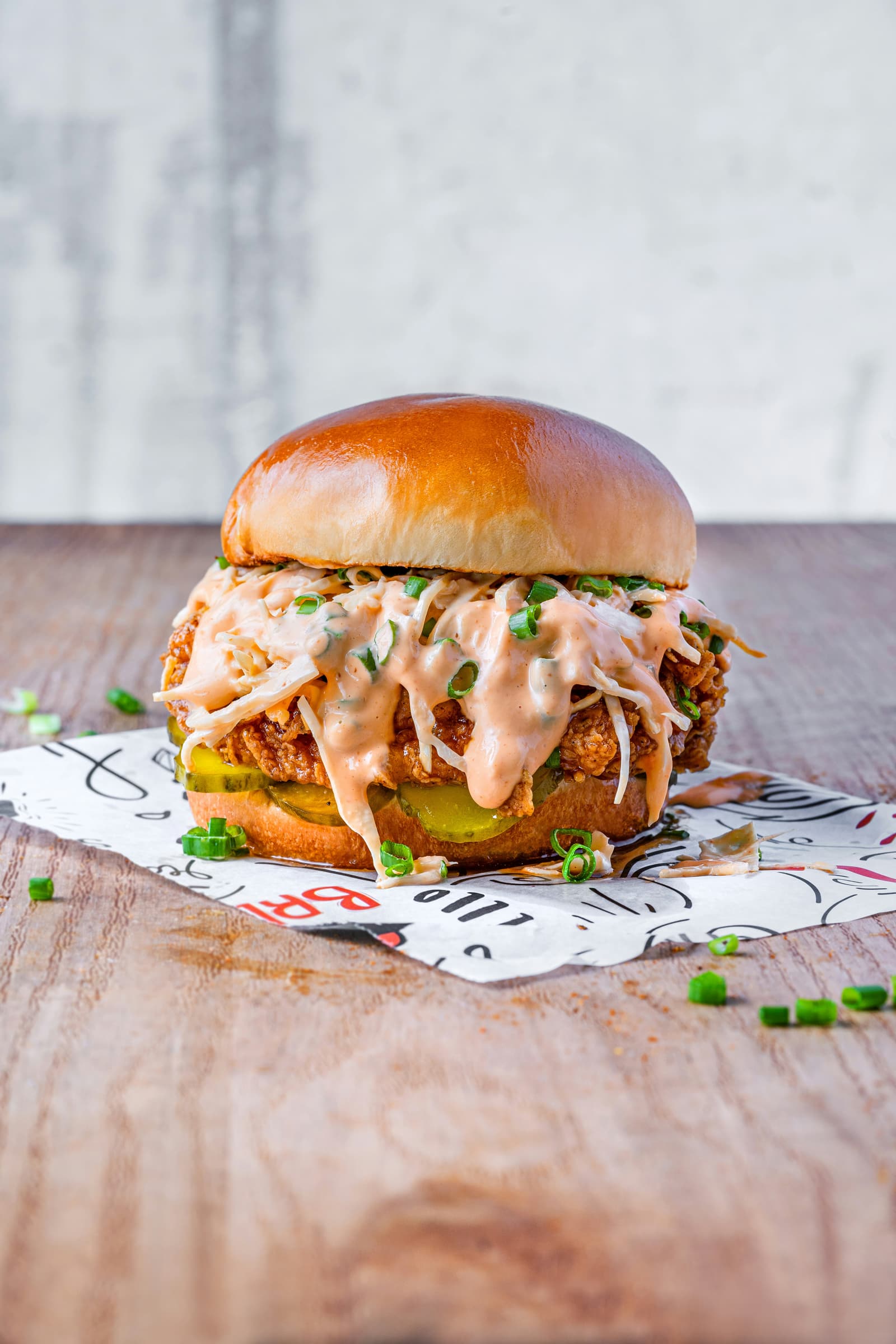 Crispy fried chicken sandwich with pickles and sauce
