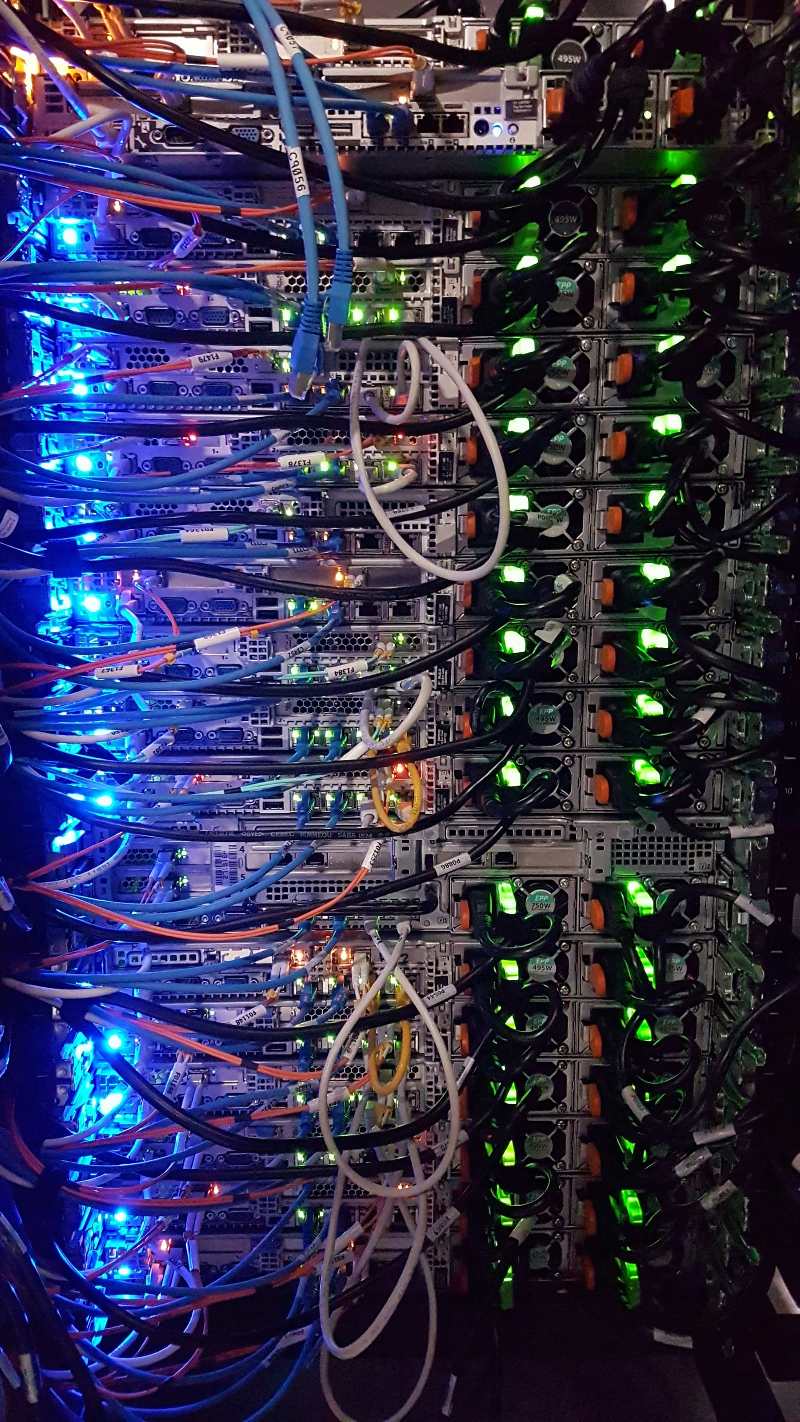 Server rack with colorful LED lights and network cables
