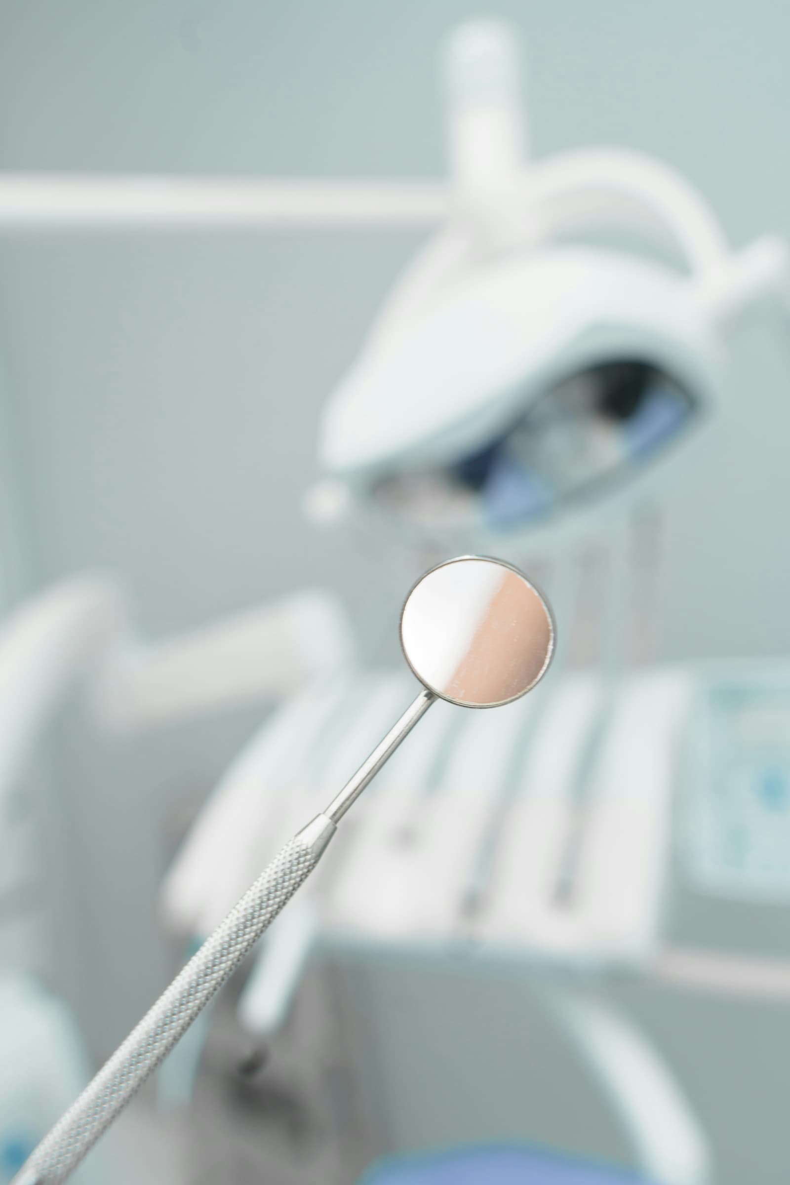 Close-up of dental mirror instrument in clinic