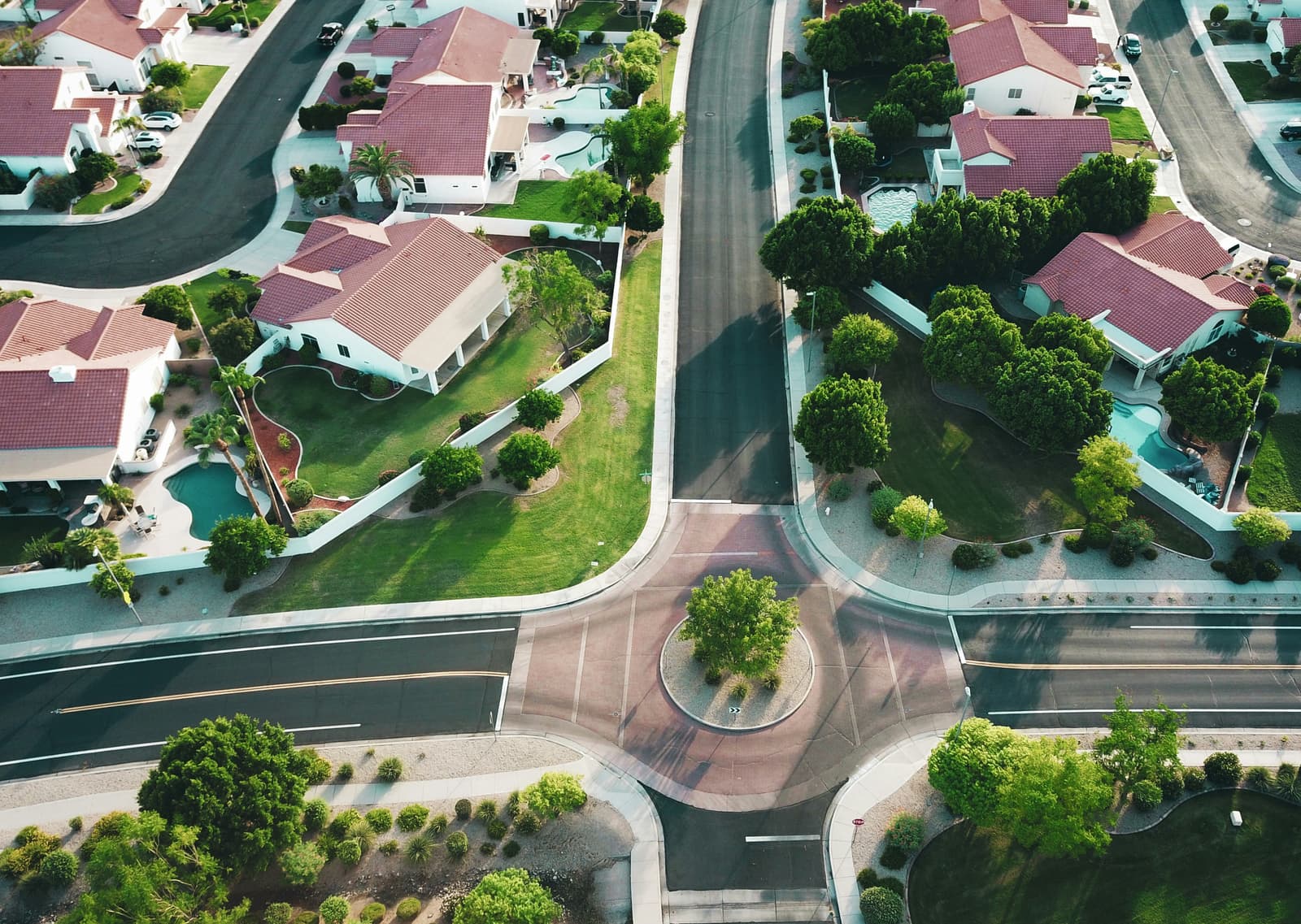 Aerial view of residential neighborhood with tree-lined streets